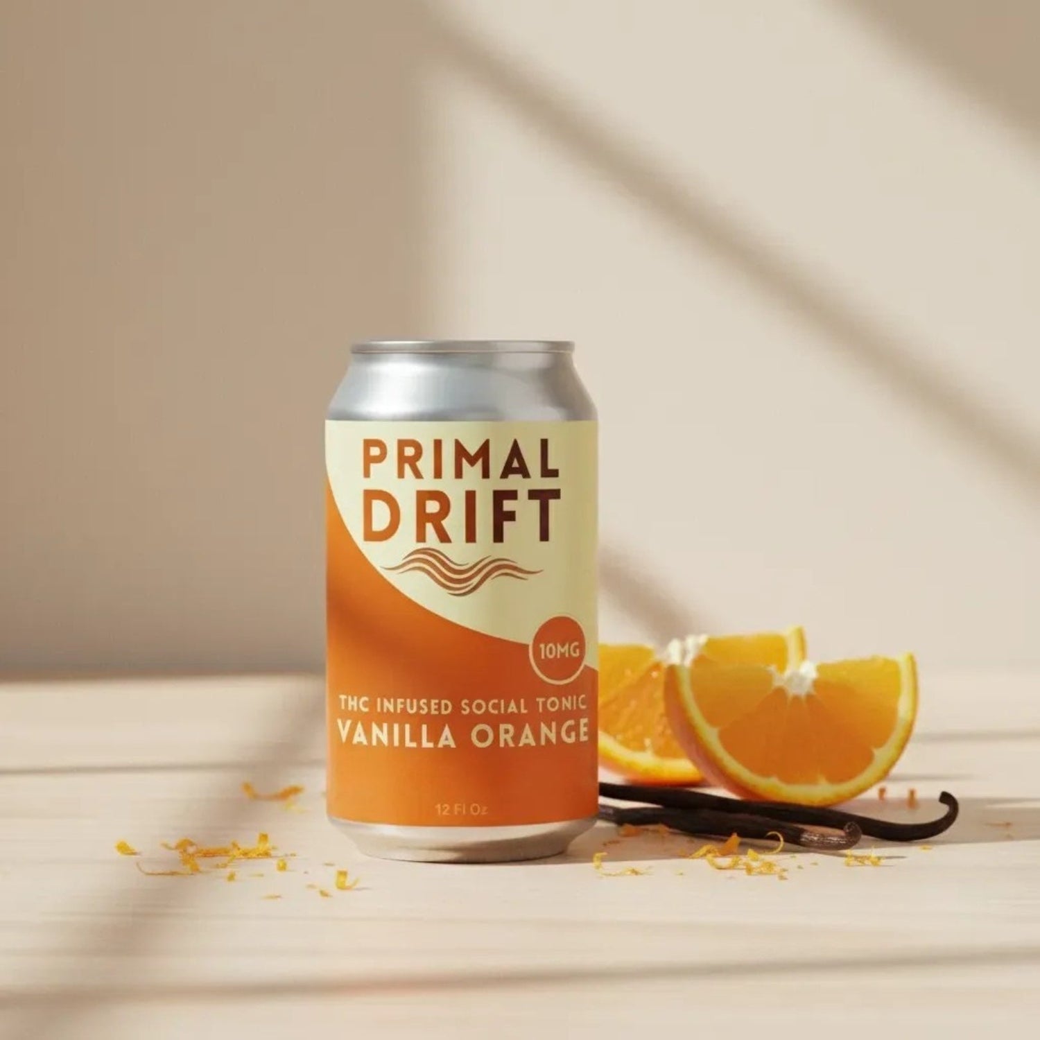 Primal Drift Vanilla Orange social tonic in natural indoor light, alcohol-free infused sparkling drink