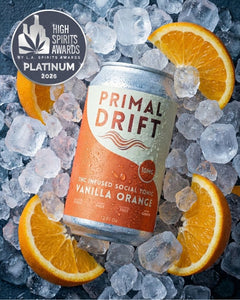 A can of Vanilla Orange Social Tonic, a creamsicle-inspired THC drink, sits among ice cubes and orange slices. The can shows "10mg" and "12 fl oz." An award badge reads "High Spirits Awards Platinum 2026.